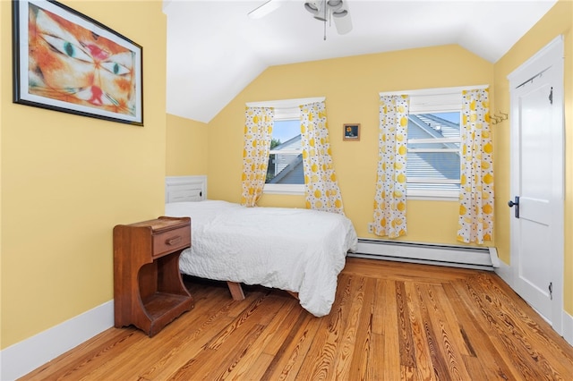 161 Ferncrest Ave, Cranston, RI 02905 - bedroom featuring a baseboard heating unit, vaulted ceiling, light wood finished floors, and a ceiling fan