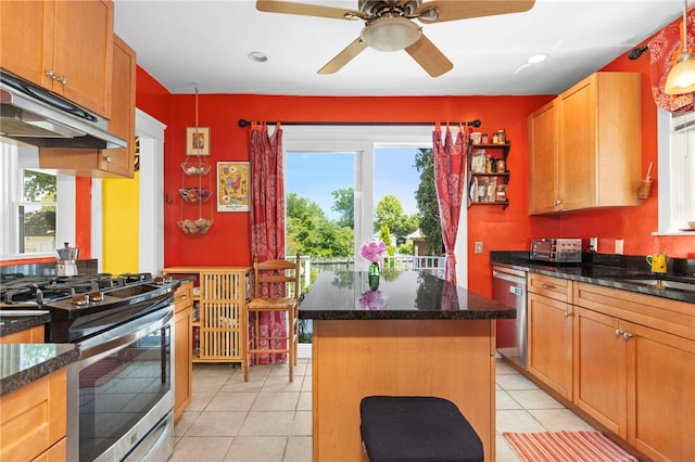 161 Ferncrest Ave, Cranston, RI 02905 - kitchen with appliances with stainless steel finishes, under cabinet range hood, plenty of natural light, a kitchen island, and recessed lighting