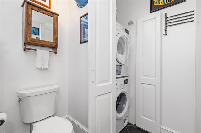 161 Ferncrest Ave, Cranston, RI 02905 - laundry area featuring stacked washer / drying machine and dark tile patterned flooring