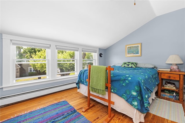 161 Ferncrest Ave, Cranston, RI 02905 - bedroom with lofted ceiling, wood finished floors, multiple windows, and a baseboard radiator