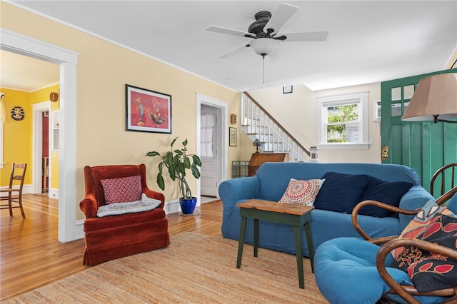 161 Ferncrest Ave, Cranston, RI 02905 - living room with wood finished floors, a ceiling fan, stairs, and ornamental molding