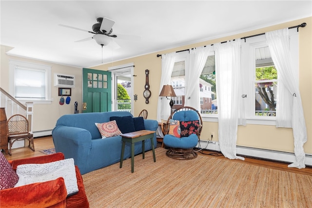 161 Ferncrest Ave, Cranston, RI 02905 - living room with wood finished floors, a baseboard radiator, a ceiling fan, and an AC wall unit