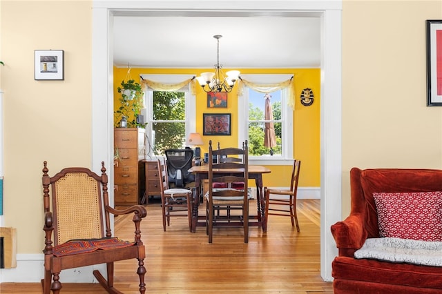161 Ferncrest Ave, Cranston, RI 02905 - dining room featuring a chandelier and wood finished floors
