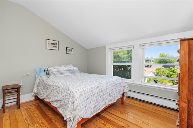 161 Ferncrest Ave, Cranston, RI 02905 - bedroom featuring a baseboard radiator, vaulted ceiling, and light wood-type flooring