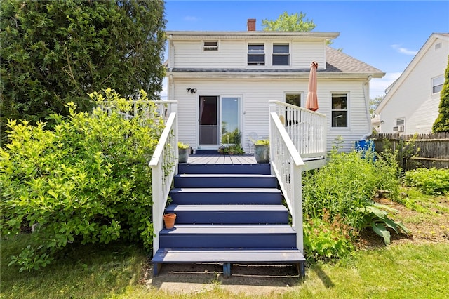 161 Ferncrest Ave, Cranston, RI 02905 - back of property with a deck, a chimney, and stairway