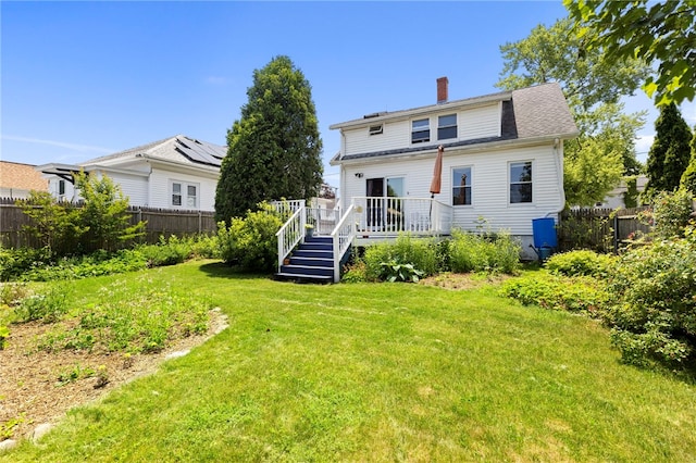 161 Ferncrest Ave, Cranston, RI 02905 - rear view of house with a wooden deck, a fenced backyard, and a chimney