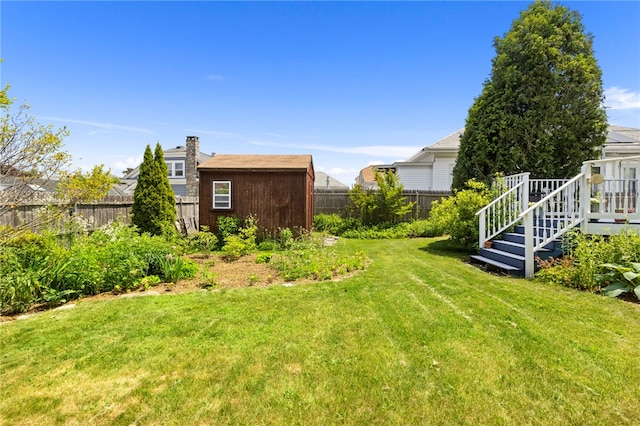 161 Ferncrest Ave, Cranston, RI 02905 - fenced backyard with a storage unit and a wooden deck