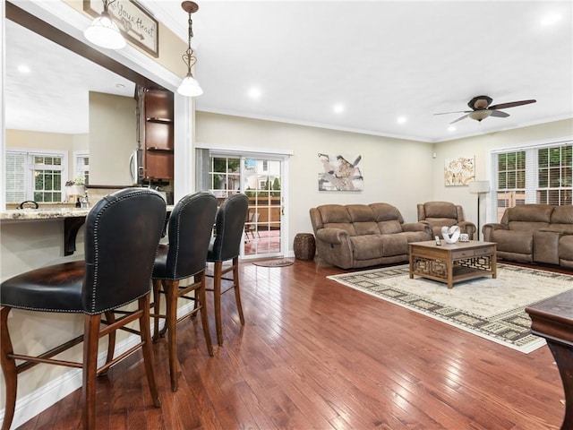 2 Medinah Dr, West Warwick, RI 02893 - living area featuring ceiling fan, plenty of natural light, dark wood-type flooring, crown molding, and recessed lighting