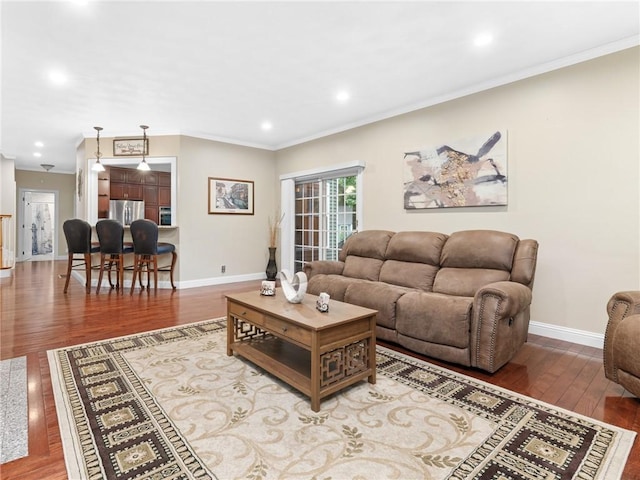 2 Medinah Dr, West Warwick, RI 02893 - living area featuring wood finished floors, ornamental molding, and recessed lighting