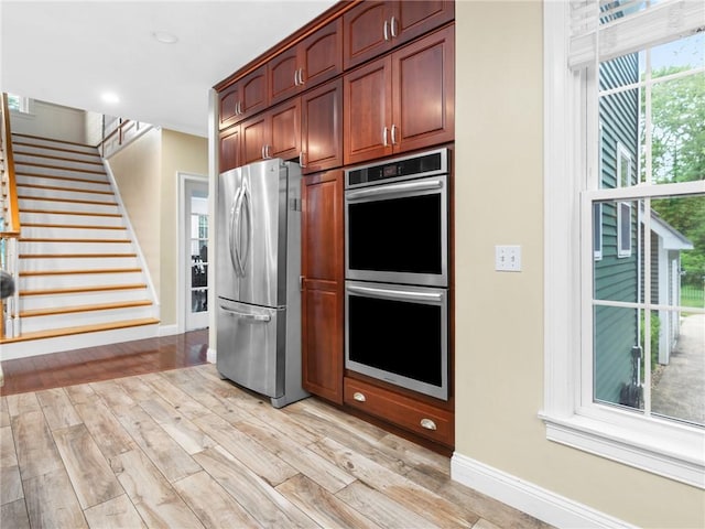 2 Medinah Dr, West Warwick, RI 02893 - kitchen with stainless steel appliances, light wood finished floors, and recessed lighting
