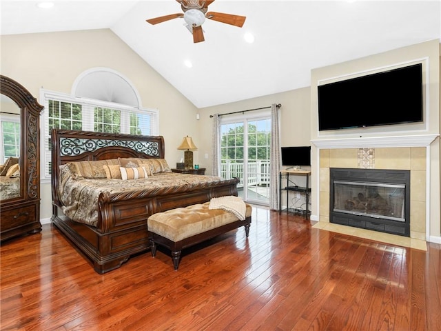 2 Medinah Dr, West Warwick, RI 02893 - bedroom featuring access to exterior, wood finished floors, a fireplace, high vaulted ceiling, and recessed lighting