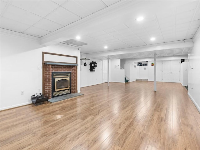 2 Medinah Dr, West Warwick, RI 02893 - unfurnished living room featuring recessed lighting, a fireplace, light wood finished floors, and stairs