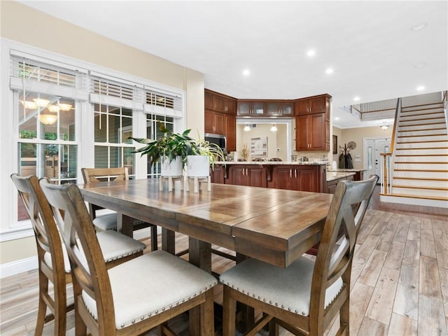 2 Medinah Dr, West Warwick, RI 02893 - dining room with light wood-style floors, stairway, recessed lighting, and a chandelier
