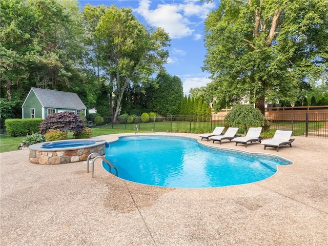 2 Medinah Dr, West Warwick, RI 02893 - view of pool featuring a patio, an outdoor structure, view of wooded area, and a pool with connected hot tub