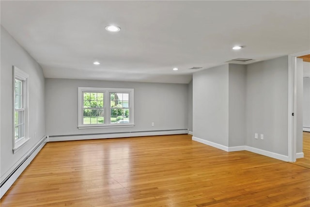 88 Grand View Rd, East Greenwich, RI 02818 - empty room with a baseboard heating unit, light wood finished floors, and recessed lighting