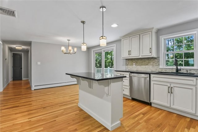 88 Grand View Rd, East Greenwich, RI 02818 - kitchen with dishwasher, baseboard heating, dark countertops, plenty of natural light, and recessed lighting