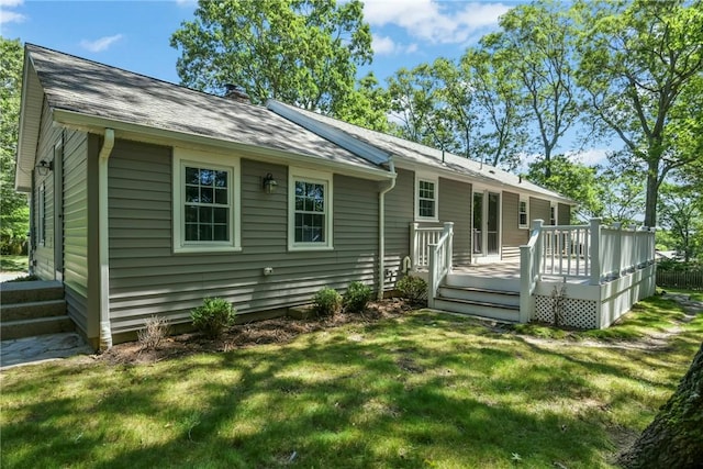 88 Grand View Rd, East Greenwich, RI 02818 - back of house featuring a chimney, a yard, a wooden deck, and a shingled roof