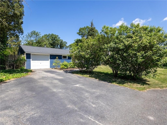 69 Haverhill Ave, Warwick, RI 02886 - view of front facade featuring driveway and an attached garage