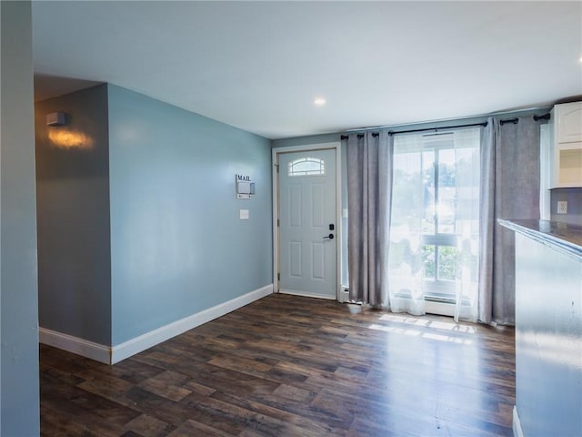 69 Haverhill Ave, Warwick, RI 02886 - foyer entrance featuring dark wood-type flooring, a baseboard radiator, and recessed lighting