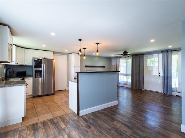 69 Haverhill Ave, Warwick, RI 02886 - kitchen with stainless steel appliances, recessed lighting, white cabinets, dark countertops, and decorative light fixtures