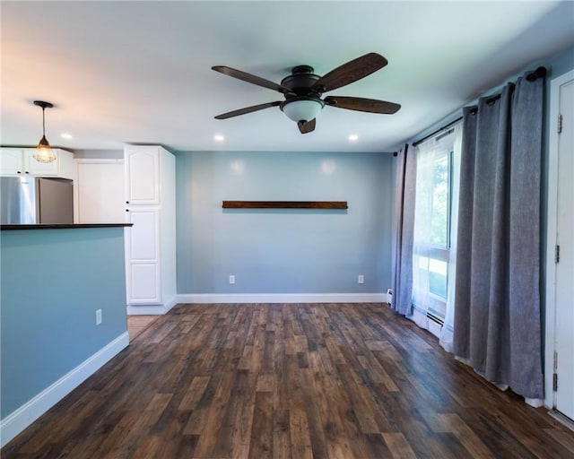 69 Haverhill Ave, Warwick, RI 02886 - unfurnished living room featuring ceiling fan, recessed lighting, and dark wood-style flooring