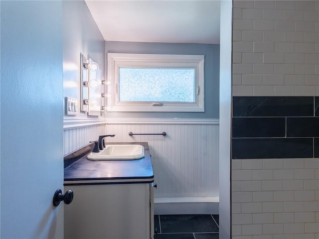 69 Haverhill Ave, Warwick, RI 02886 - bathroom featuring vanity, a wainscoted wall, and tile patterned flooring