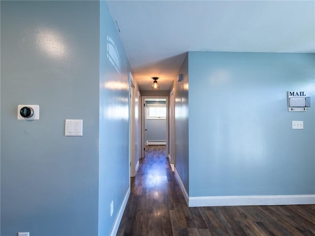 69 Haverhill Ave, Warwick, RI 02886 - hall with a baseboard radiator and dark wood-type flooring