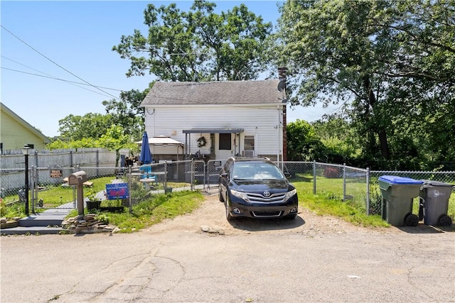 10 Sacramento St, Providence, RI 02909 - view of front facade with a gate and a chimney
