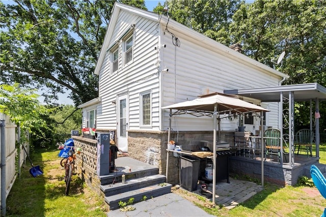 10 Sacramento St, Providence, RI 02909 - view of side of property with stone siding