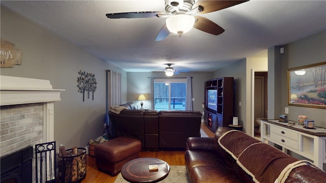 4 Tray Hollow Rd, Foster, RI 02825 - living area featuring a ceiling fan, wood finished floors, and a brick fireplace
