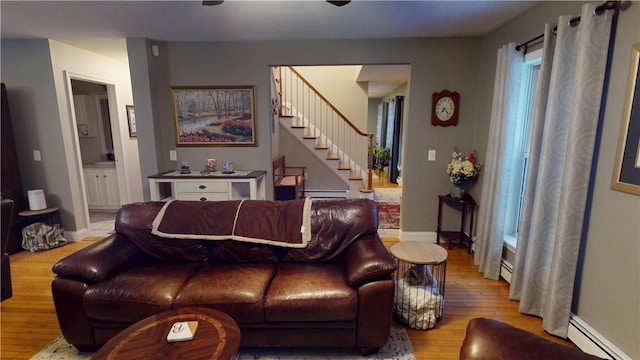 4 Tray Hollow Rd, Foster, RI 02825 - living area featuring a baseboard radiator, wood finished floors, stairs, and a baseboard heating unit