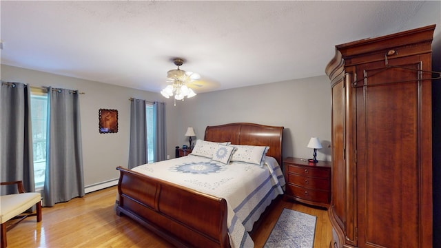 4 Tray Hollow Rd, Foster, RI 02825 - bedroom with a baseboard radiator, multiple windows, and light wood finished floors