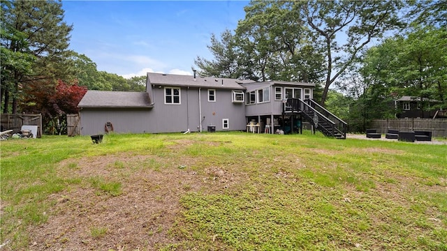 14 Deer Run Dr, Coventry, RI 02816 - rear view of property with stairs and a sunroom