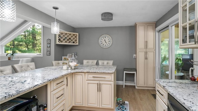 14 Deer Run Dr, Coventry, RI 02816 - kitchen with cream cabinetry, light wood-style floors, light stone countertops, and glass insert cabinets