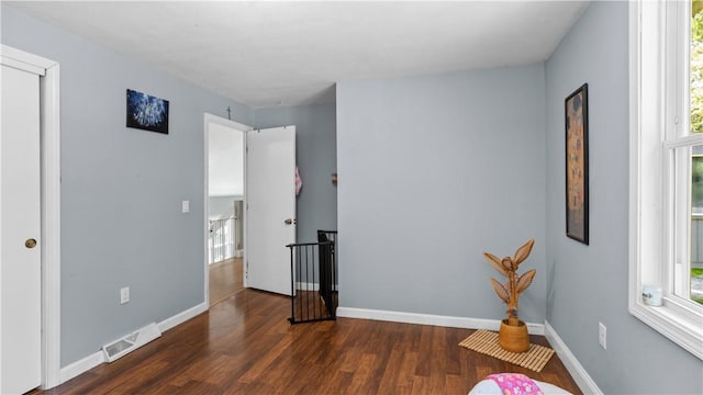 14 Deer Run Dr, Coventry, RI 02816 - unfurnished bedroom featuring multiple windows and wood finished floors