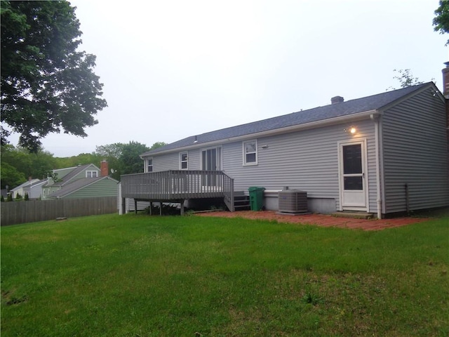 155 Lewiston St, Warwick, RI 02889 - back of property with a deck and a chimney