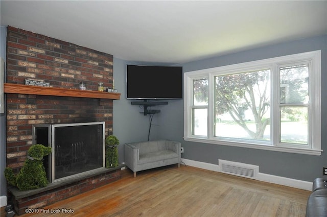 62 Stone Ave, Warwick, RI 02889 - living room featuring a fireplace and wood finished floors