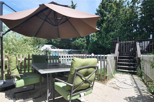 62 Stone Ave, Warwick, RI 02889 - fenced backyard with outdoor dining space and a patio