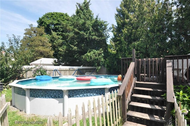 62 Stone Ave, Warwick, RI 02889 - view of swimming pool featuring a fenced backyard and a wooden deck