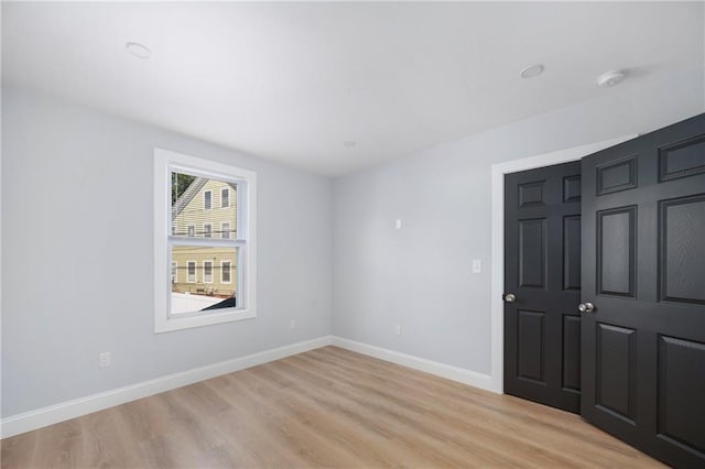312 Veazie St, Providence, RI 02904 - unfurnished bedroom with light wood finished floors and baseboards