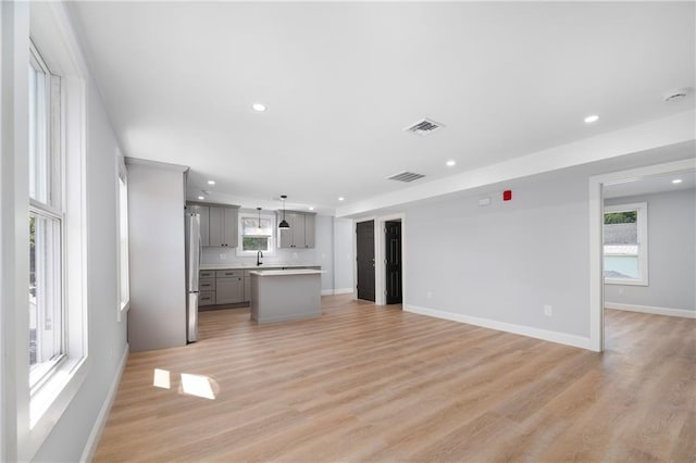 312 Veazie St, Providence, RI 02904 - unfurnished living room featuring recessed lighting and light wood-style floors