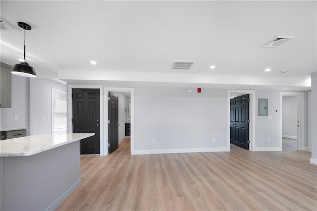 312 Veazie St, Providence, RI 02904 - unfurnished living room with electric panel, light wood-style flooring, and recessed lighting