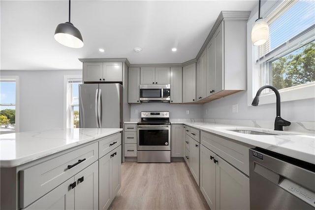 312 Veazie St, Providence, RI 02904 - kitchen featuring stainless steel appliances, gray cabinetry, light wood-type flooring, light stone counters, and recessed lighting