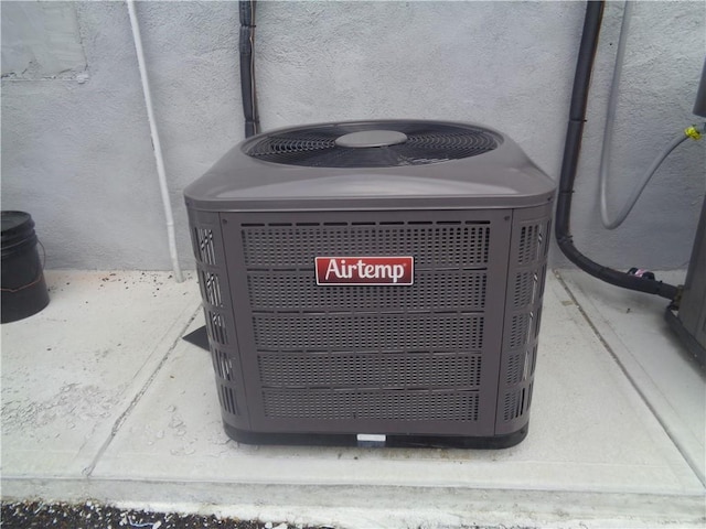 312 Veazie St, Providence, RI 02904 - exterior view of a central air condition unit and stucco siding