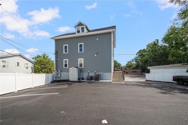 312 Veazie St, Providence, RI 02904 - back of property featuring uncovered parking and stairs