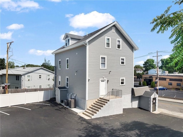 312 Veazie St, Providence, RI 02904 - view of home's exterior featuring a shed and uncovered parking