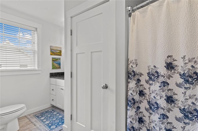 83 Silas Hill Way, Exeter, RI 02822 - bathroom with vanity, wood finished floors, and curtained shower
