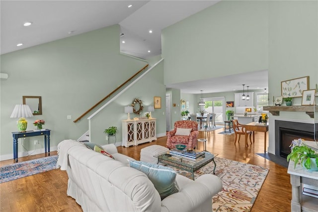 83 Silas Hill Way, Exeter, RI 02822 - living room with high vaulted ceiling, stairs, wood finished floors, and recessed lighting