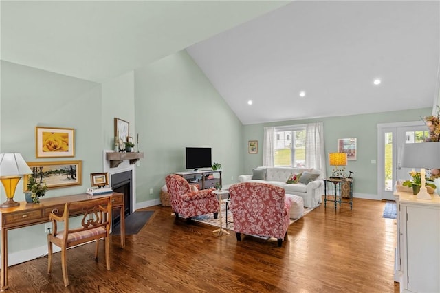 83 Silas Hill Way, Exeter, RI 02822 - living area featuring wood finished floors, high vaulted ceiling, a fireplace with flush hearth, and recessed lighting