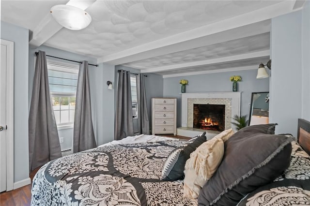 273 Main St, Cranston, RI 02823 - bedroom featuring beam ceiling, wood finished floors, and a fireplace